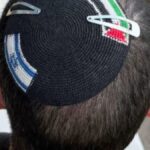 Israeli Police Detain Man Over Dual-Flag Kippah, Spark Debate on Expression